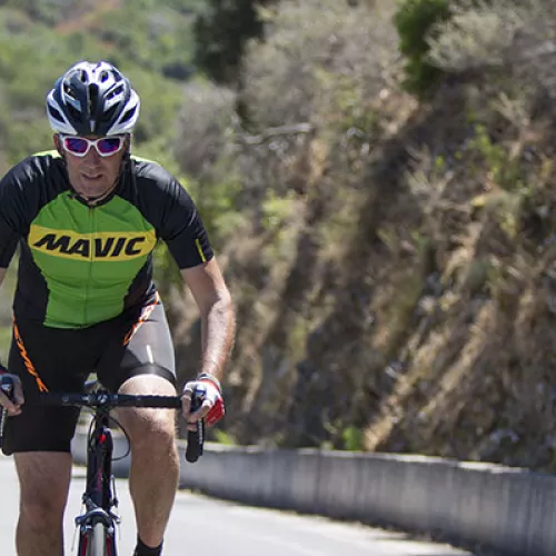 Man and woman road cycling
