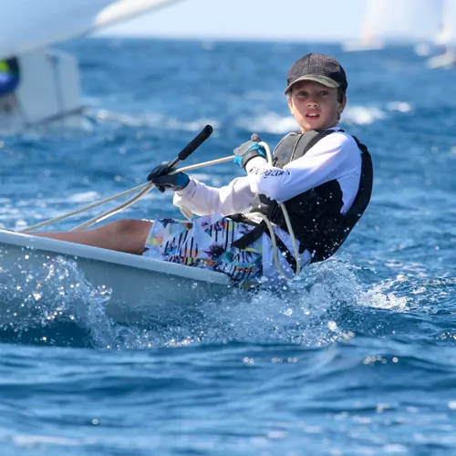 young boy dinghy sailing