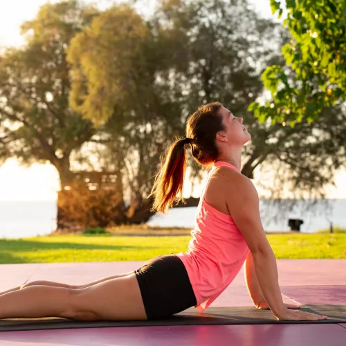 Woman doing yoga outdoors in Greece