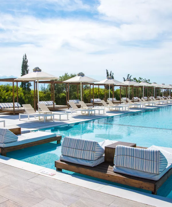 Swimming pool and sun loungers at Buca Beach Club