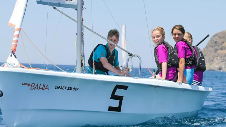 Wave Riders sailing a Laser Bahia with instructor on board