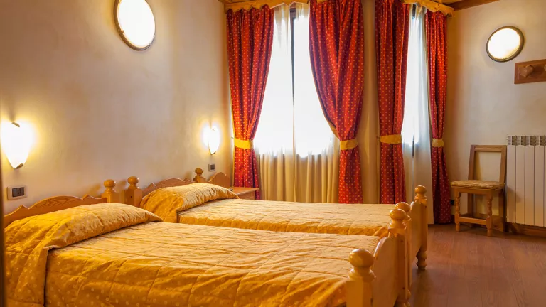 A twin bedroom with handmade furniture