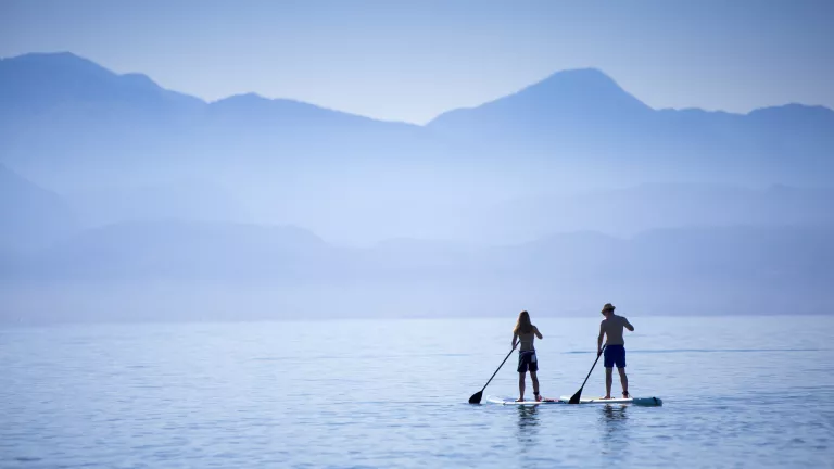 Paddle boarding at Buca Beach Club