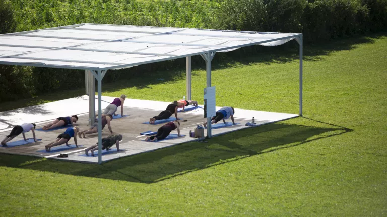 Fitness platform in the gardens at Buca Beach Club