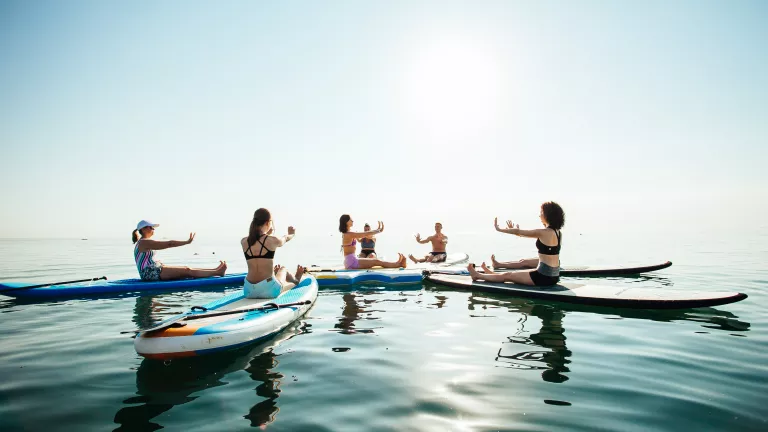 Sunrise and sunset SUP yoga at Neilson x Cook's Club Adakoy