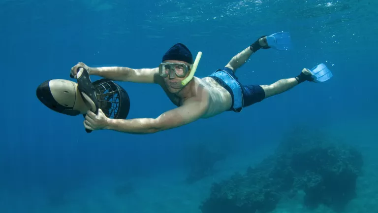 Explore vibrant marine life with sea scooters at Neilson | Cook's Club Adakoy