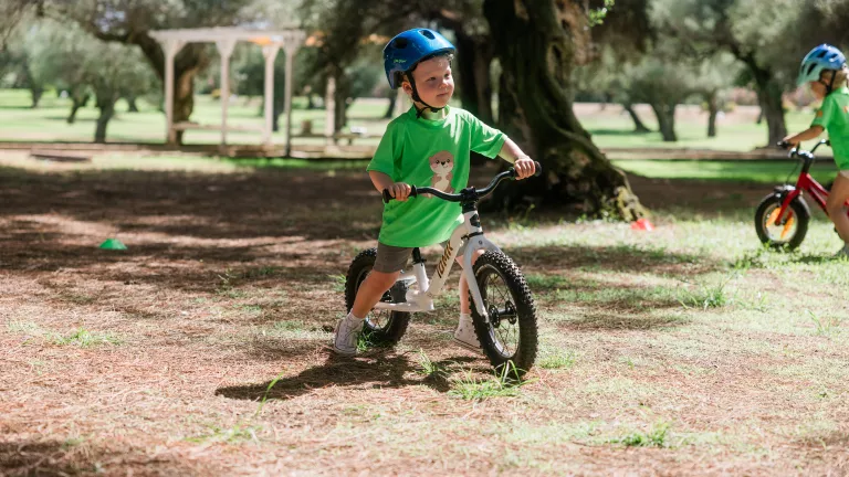 Cycling for children around the resort at Neilson x Mangia's Torre del Barone