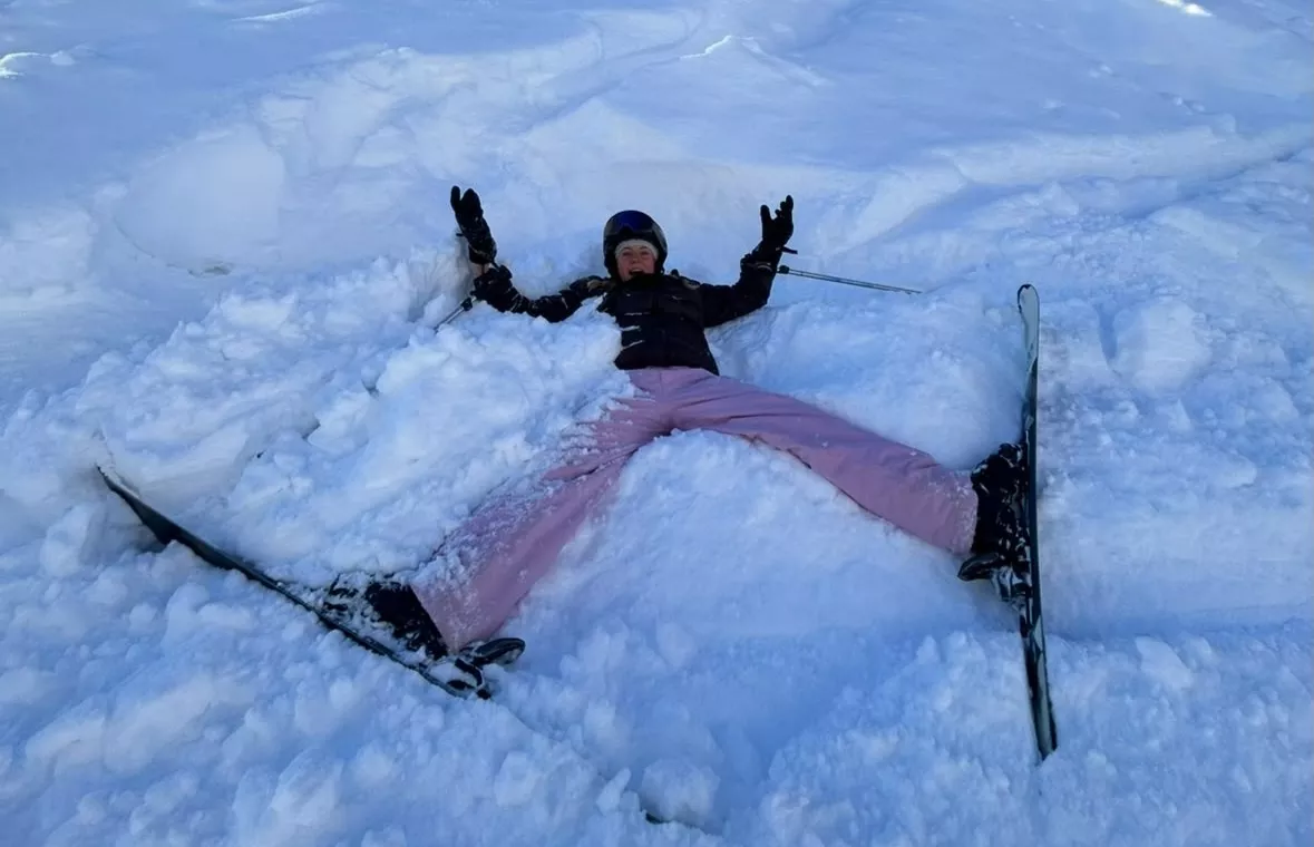 Girl making a snow angel
