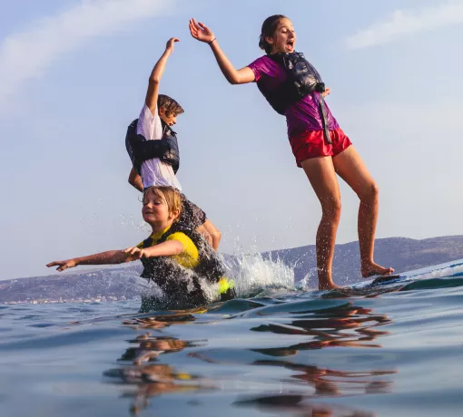 kids on paddle board