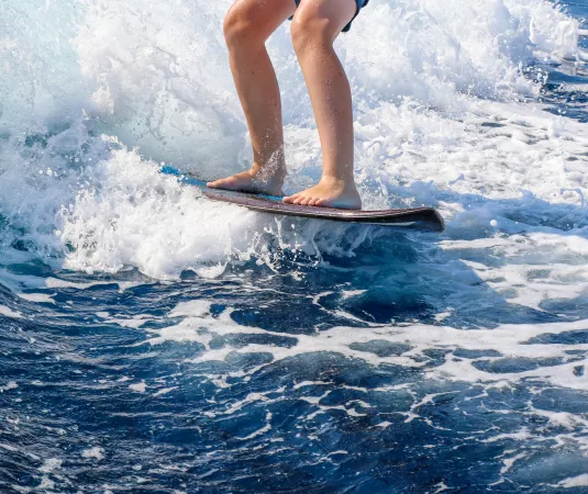 A child wakeboarding