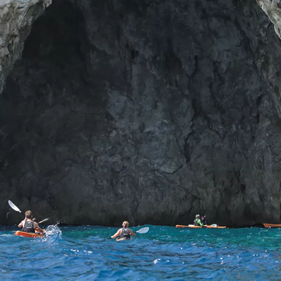 Exploring the caves by sea kayak