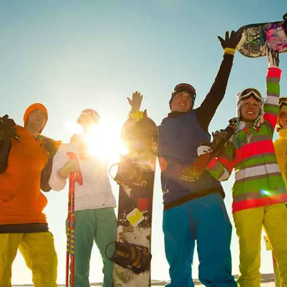 group of young skiers and snowboarders