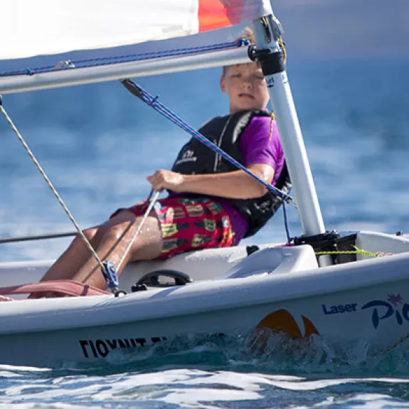 young boy dinghy sailing
