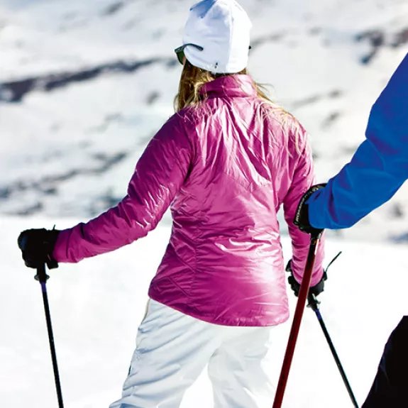 A couple learning to ski