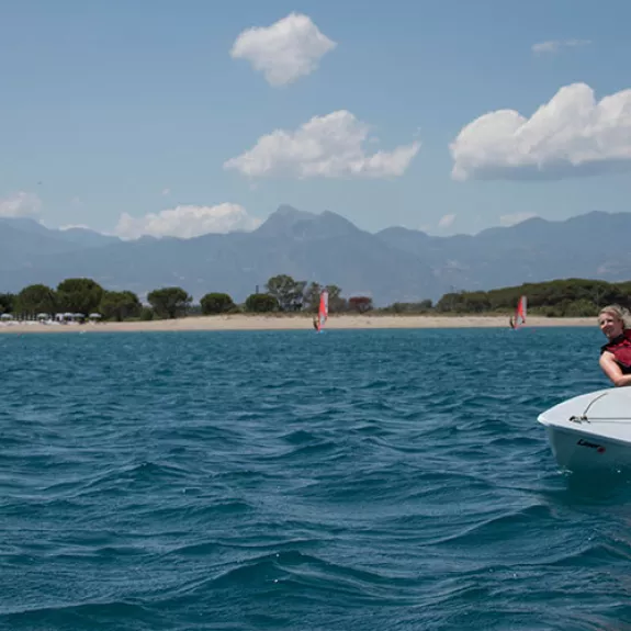 Woman sailing a dinghy