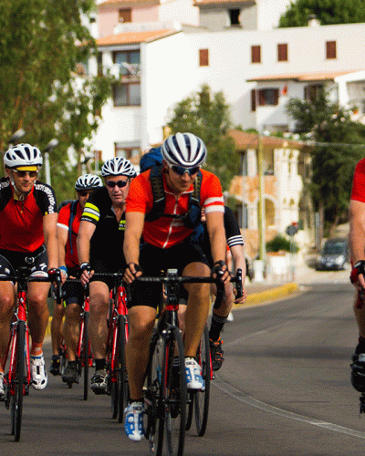 Group of people road cycling in Sardinia