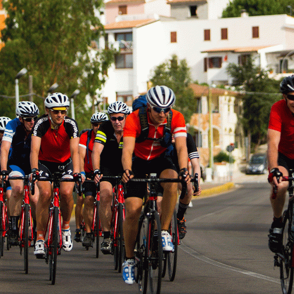 Group of people road cycling in Sardinia