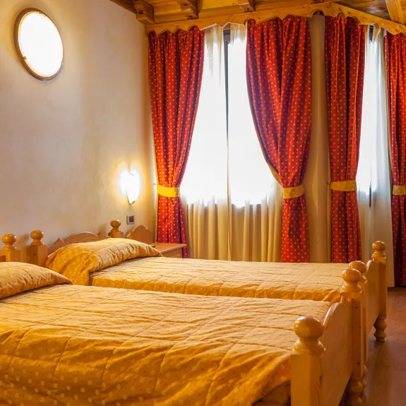 A twin bedroom with handmade furniture