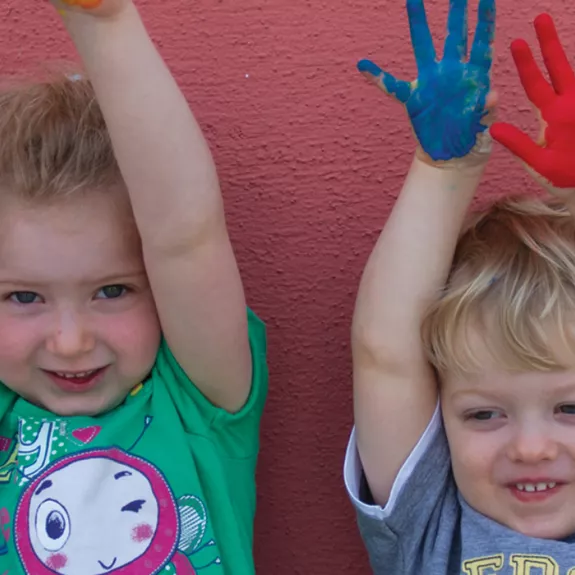 children doing hand painting