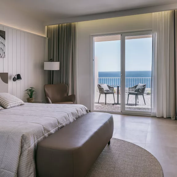 A typical bedroom at Neilson x Mangia's Torre del Barone Resort