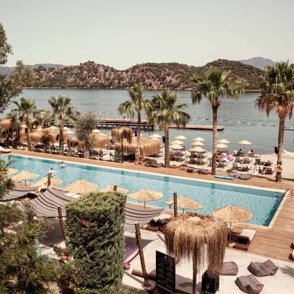Swimming pool and beach front at Neilson x Cook's Club Adakoy