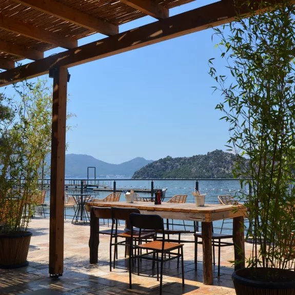Waterfront restaurant terrace at Neilson x Cook's Club Adakoy