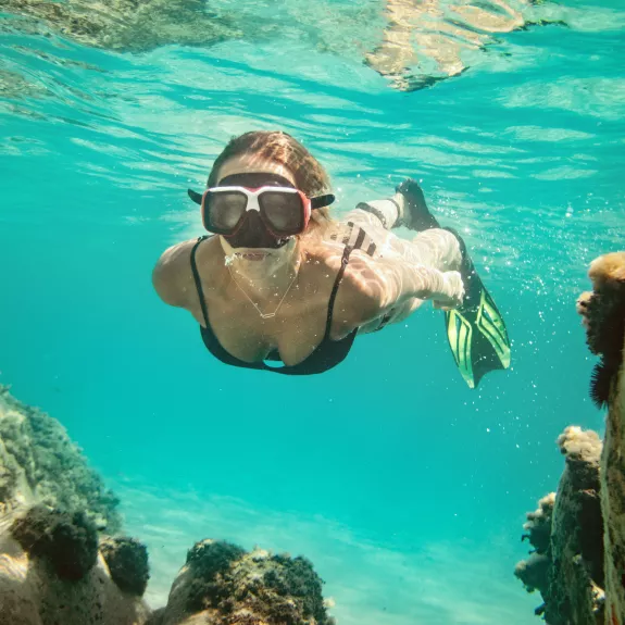 Snorkelling in the crystal clear waters at Neilson x Cook's Club Adakoy