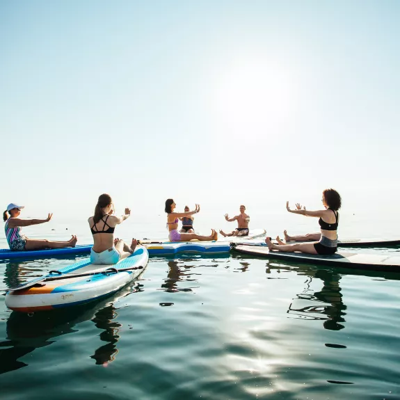 Sunrise and sunset SUP yoga at Neilson x Cook's Club Adakoy