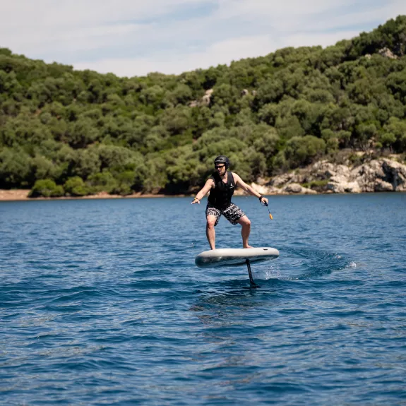 a person riding a hydrofoil surfboard