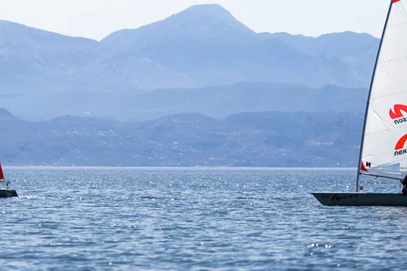 two people sailing Laser Dinghies