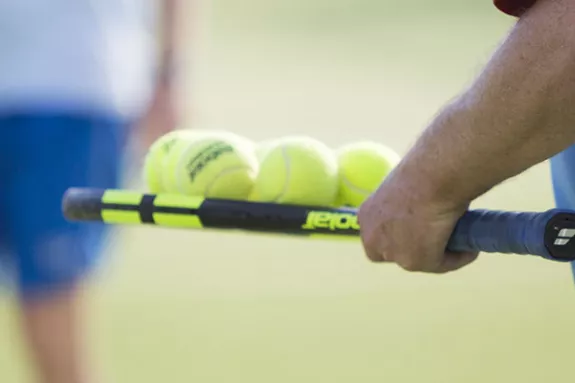 people on tennis court