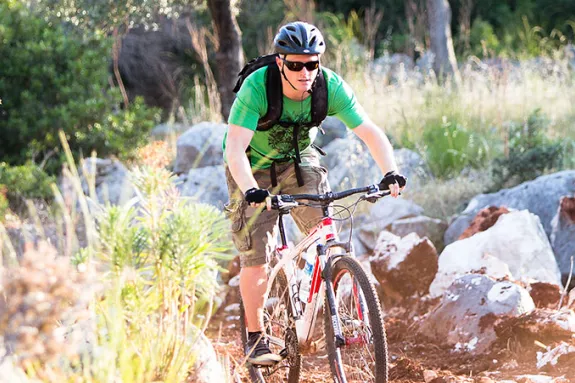 two men off road mountain biking