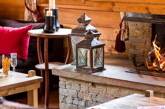 lounge and open fire in a Neilson ski chalet