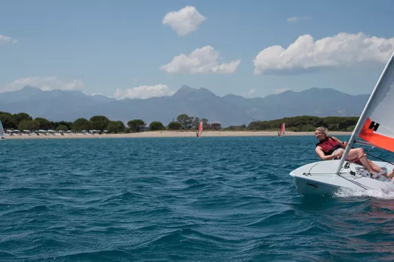 Woman sailing a dinghy