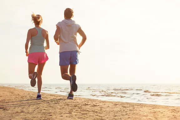 couple running on a beach