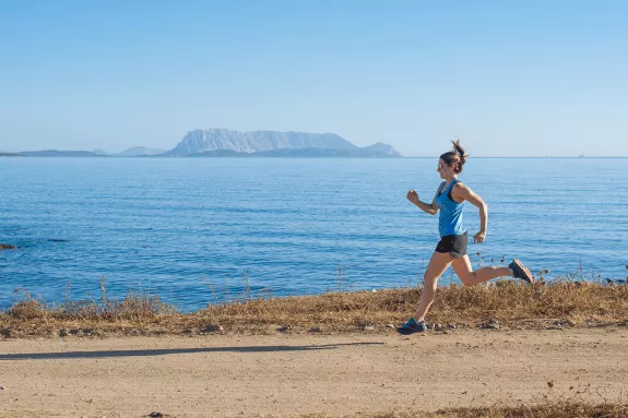 girl running by the sea