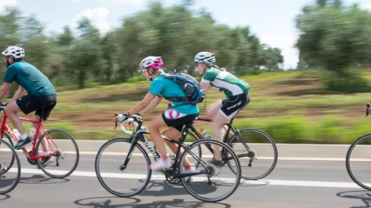 Group of people road biking