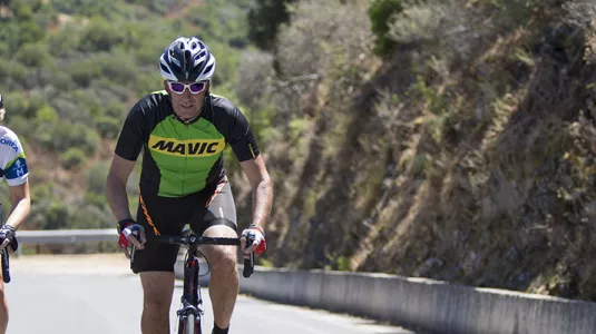 Man and woman road cycling