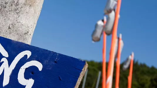 Beach and sailing signpost