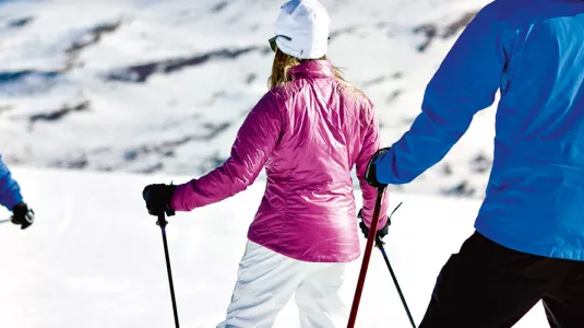 A couple learning to ski