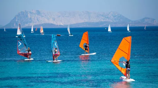 Group of beginners windsurfing