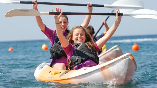 Two teenagers on a kayak