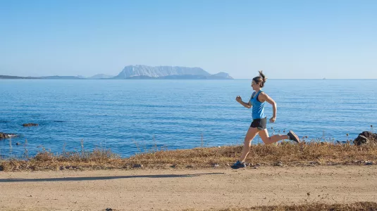girl running by the sea