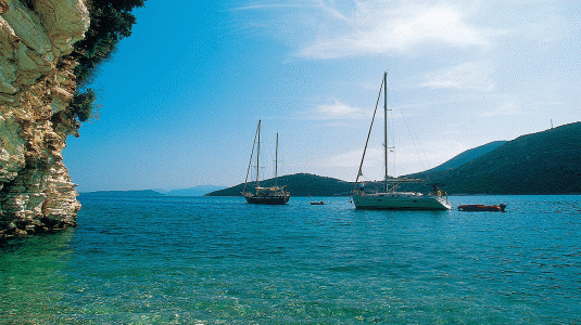 two yachts moored up in a cove in Greece