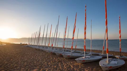 View of dinghies on Messini Beach at sunrise