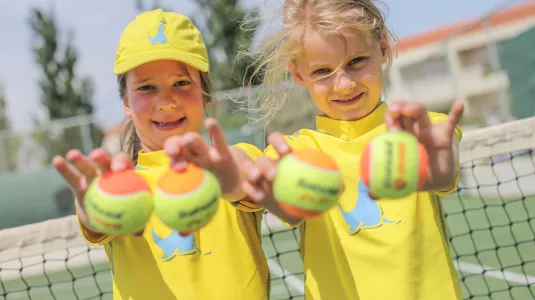 Girls holding tennis balls
