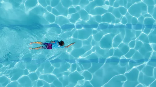 Girl swimming front crawl