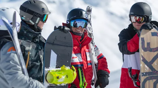 group of skiers and boarders