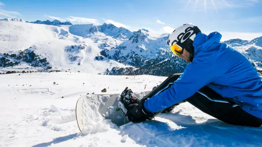 boarder putting on his board
