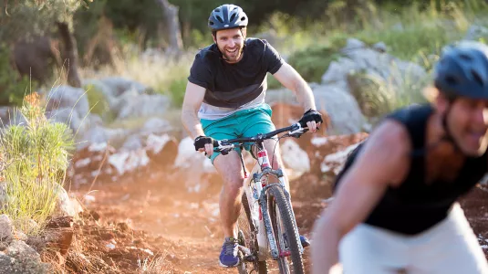 Two men mountain biking